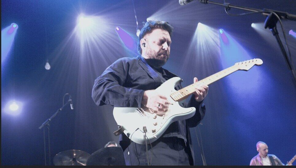Guitarist on stage at the Gare du Nord anniversary concert